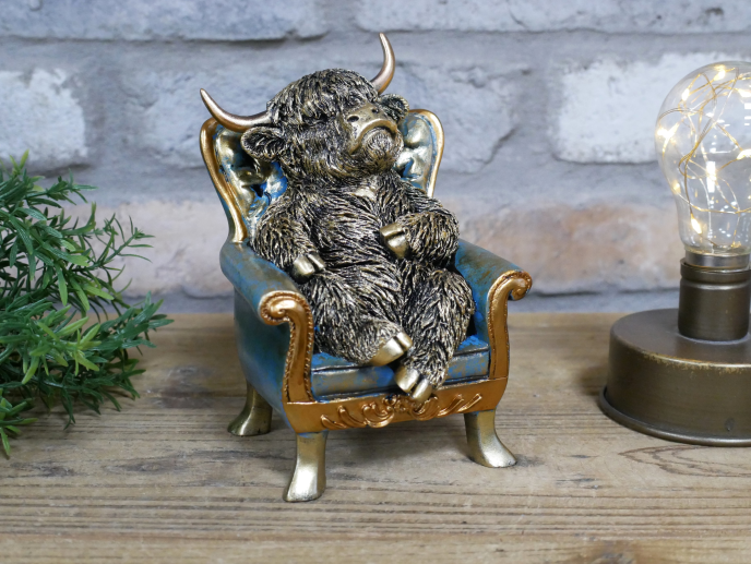 Highland Cow On A Chair